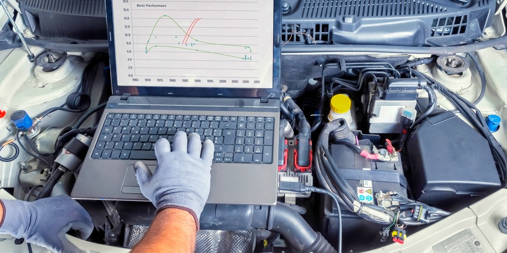 automotive diagnostics mechanic performing troubleshooting tests